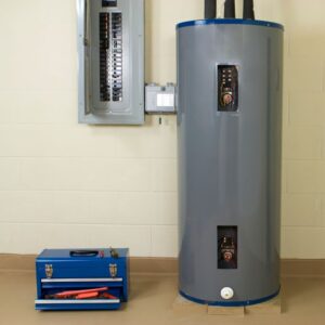 gray water heater next to a fuse box and blue tool box