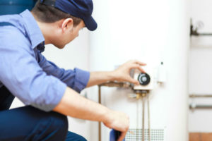 man servicing water heater 