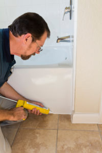 man fixing tub